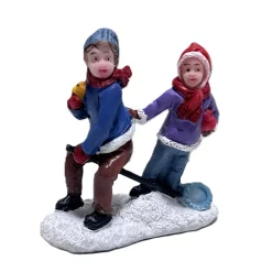 Kerstdorp spelende kinderen